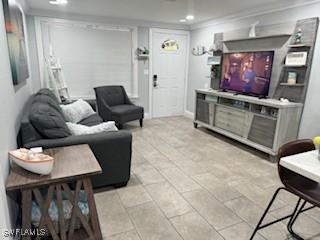 living room featuring recessed lighting and ornamental molding