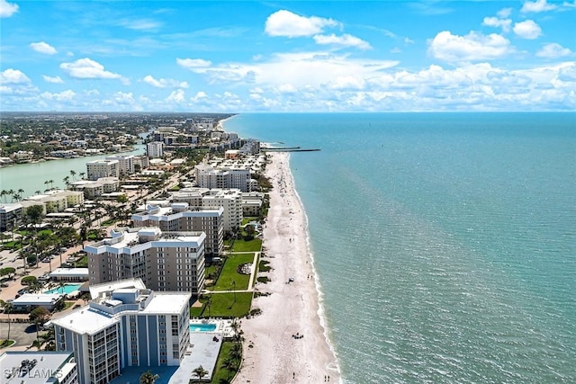 aerial view with a water view, a view of city, and a beach view