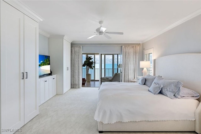 carpeted bedroom featuring access to outside, a ceiling fan, and ornamental molding