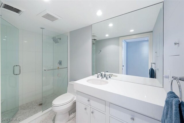 full bath with visible vents, a stall shower, and toilet