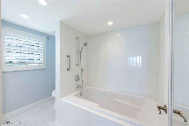 bathroom featuring recessed lighting, baseboards, toilet, and shower / tub combination