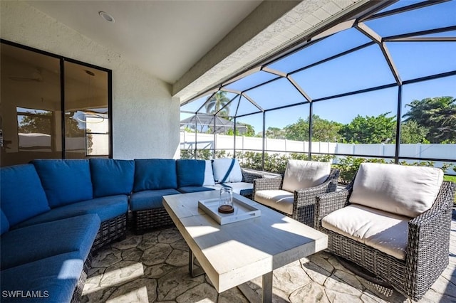 view of patio / terrace with a lanai and an outdoor living space