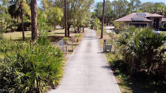 view of property's community featuring a gate and a fenced front yard