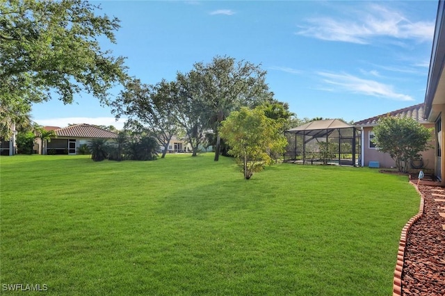 view of yard with a lanai