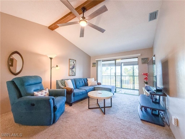 living area with a ceiling fan, visible vents, carpet floors, a textured ceiling, and beamed ceiling