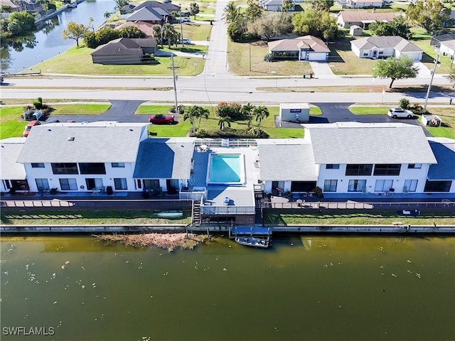 bird's eye view with a water view and a residential view