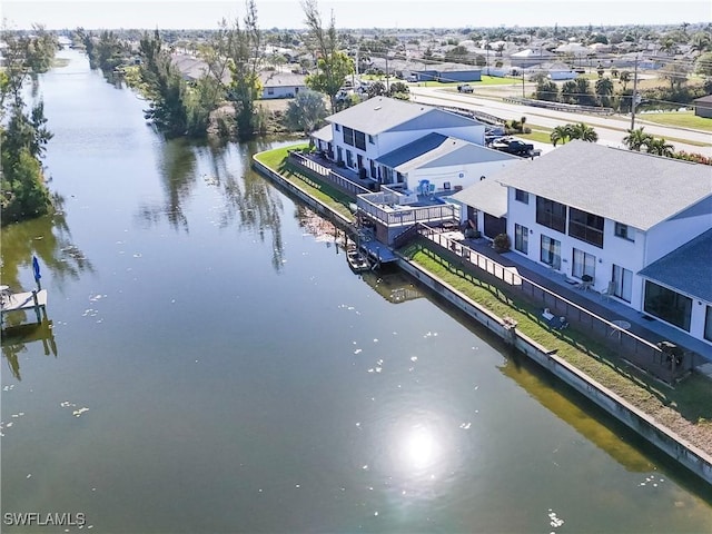 birds eye view of property featuring a residential view and a water view