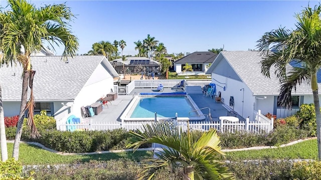 view of swimming pool featuring a fenced in pool, a patio, and a fenced backyard