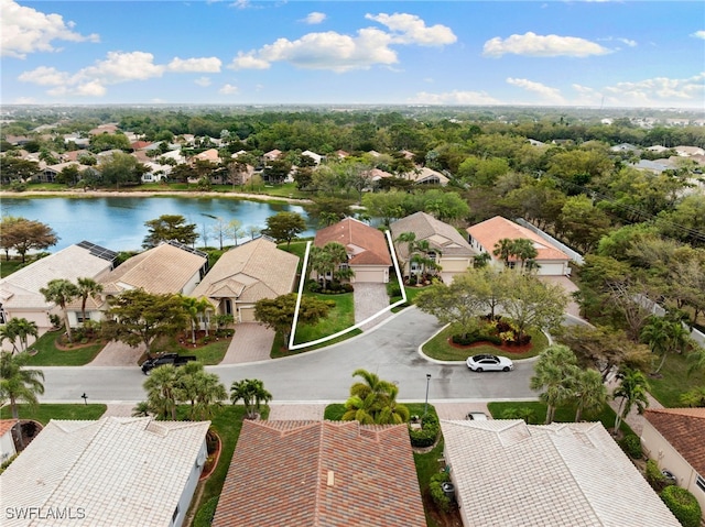 aerial view with a residential view and a water view