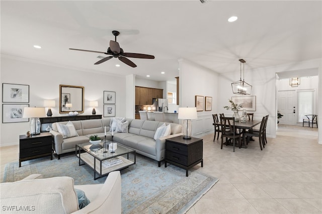 living area with light tile patterned flooring, recessed lighting, and ornamental molding