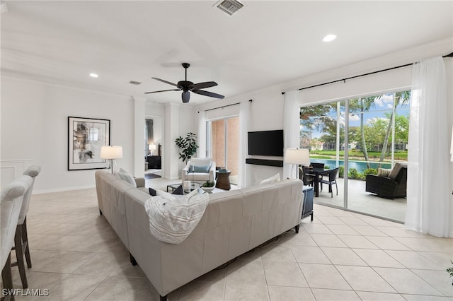 living area featuring light tile patterned floors, recessed lighting, and visible vents