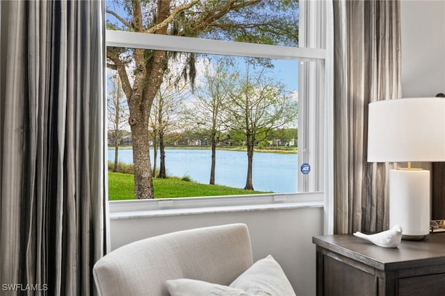 living area featuring a water view