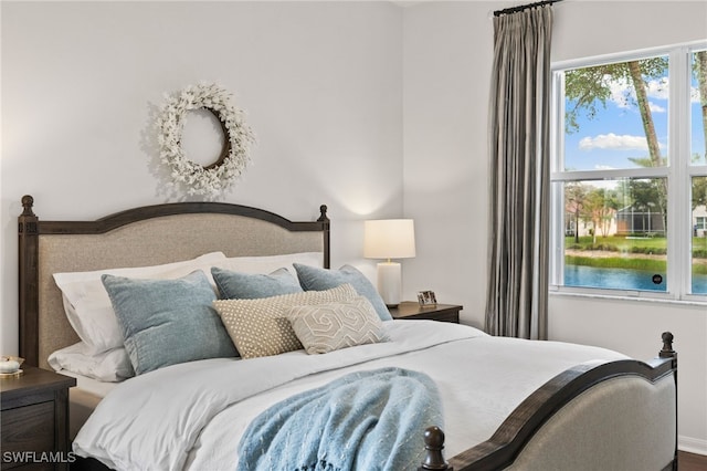 bedroom featuring baseboards