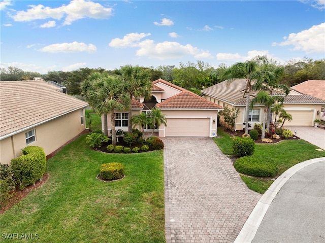 view of front facade with stucco siding, decorative driveway, a garage, and a front lawn