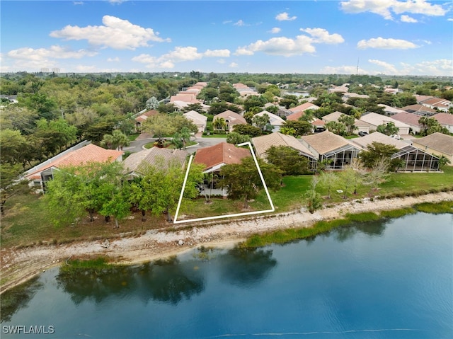 drone / aerial view featuring a residential view and a water view