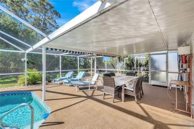 outdoor pool featuring a patio area, outdoor dining space, and glass enclosure