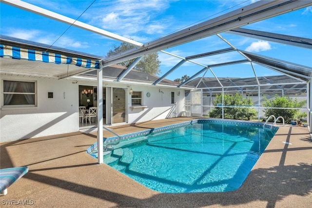 pool featuring a lanai and a patio area