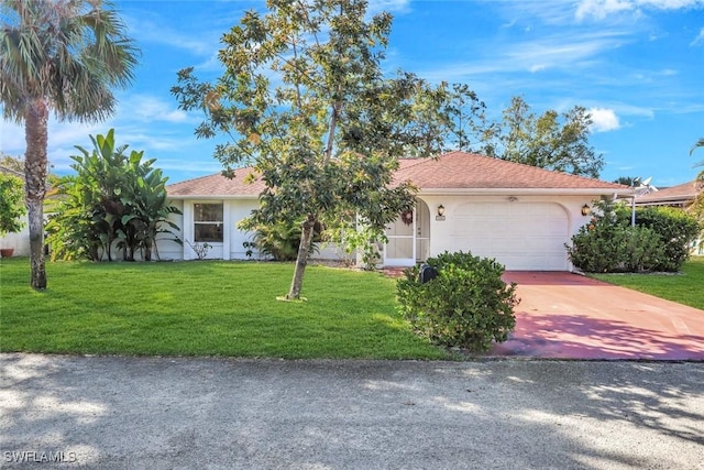 view of front of home featuring stucco siding, a front yard, concrete driveway, and an attached garage