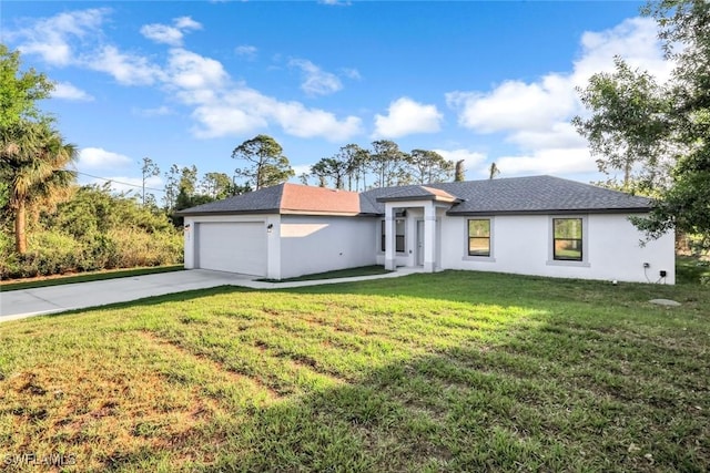 view of front facade with a garage, stucco siding, driveway, and a front lawn