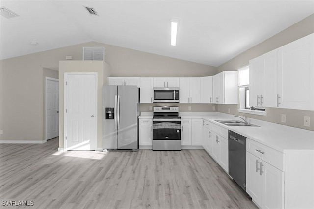 kitchen featuring a sink, visible vents, appliances with stainless steel finishes, and light countertops