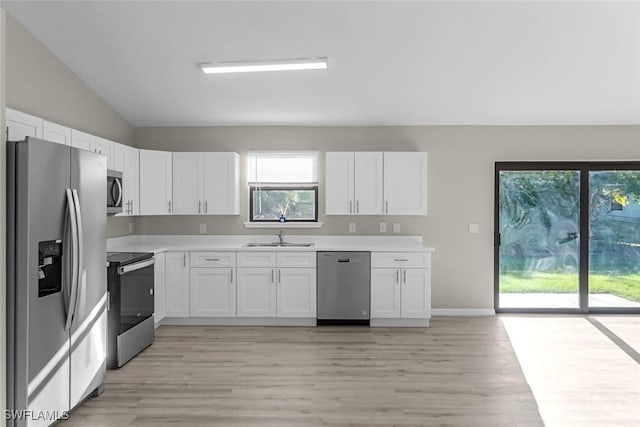 kitchen featuring a sink, light countertops, white cabinetry, and stainless steel appliances