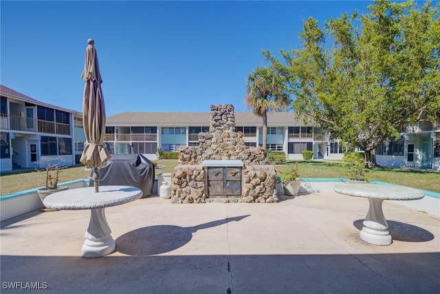 view of property's community with a patio area