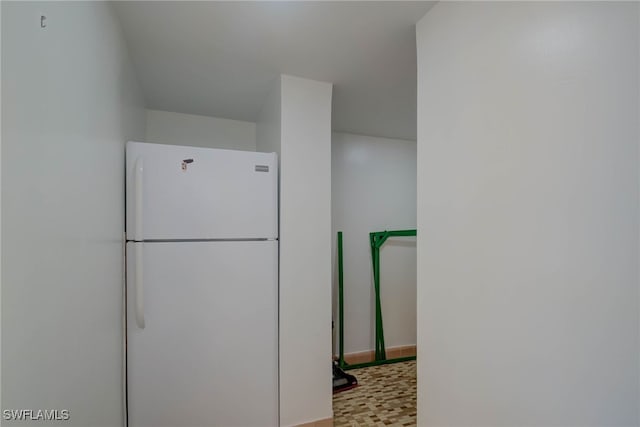 kitchen with freestanding refrigerator