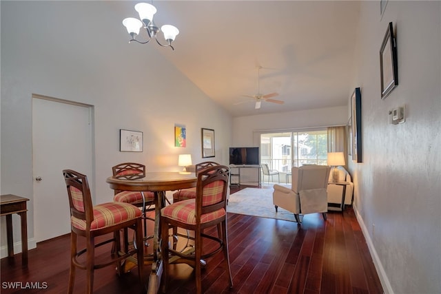 dining space featuring baseboards, high vaulted ceiling, dark wood-style flooring, and ceiling fan with notable chandelier