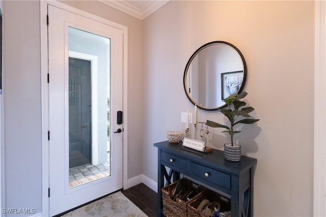 doorway to outside featuring crown molding, baseboards, and dark wood-style flooring