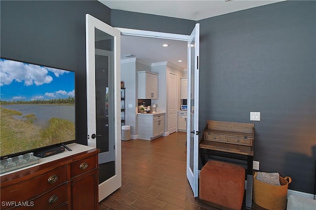 interior space featuring baseboards, white cabinets, dark wood-style flooring, and light countertops