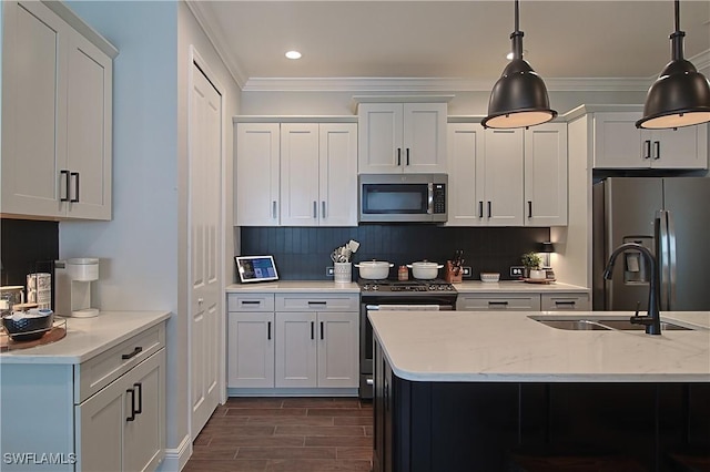 kitchen with a sink, stainless steel appliances, tasteful backsplash, and crown molding