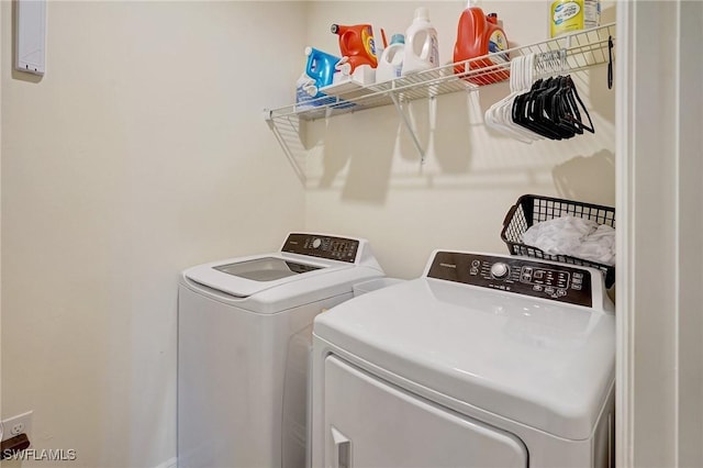 washroom featuring laundry area and independent washer and dryer