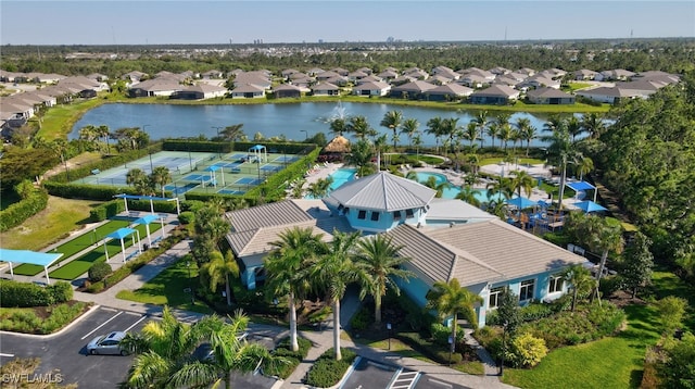 drone / aerial view with a residential view and a water view