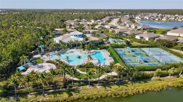 birds eye view of property featuring a residential view and a water view