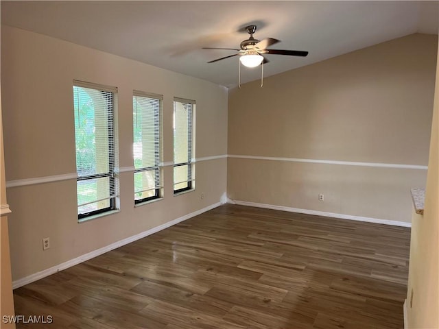 unfurnished room with wood finished floors, baseboards, and ceiling fan