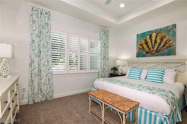 carpeted bedroom featuring recessed lighting, a ceiling fan, a tray ceiling, and baseboards