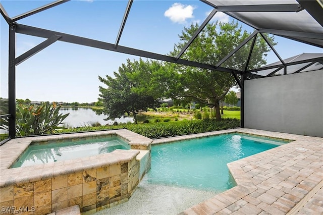 view of pool with a water view, a pool with connected hot tub, a lanai, and a patio area