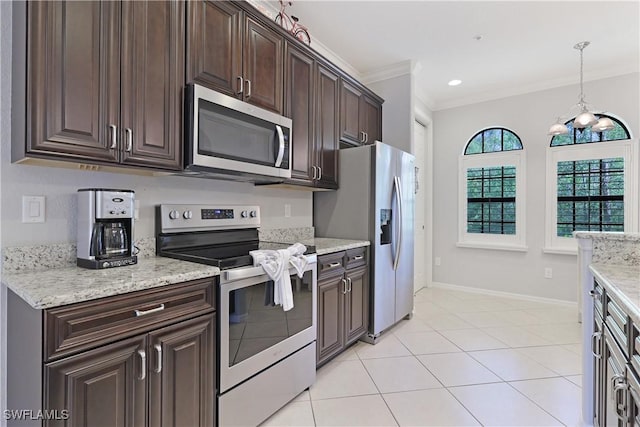 kitchen featuring baseboards, ornamental molding, hanging light fixtures, dark brown cabinetry, and stainless steel appliances