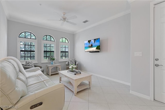 living area with visible vents, a ceiling fan, light tile patterned flooring, crown molding, and baseboards