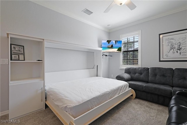 bedroom featuring crown molding, a ceiling fan, visible vents, and carpet floors