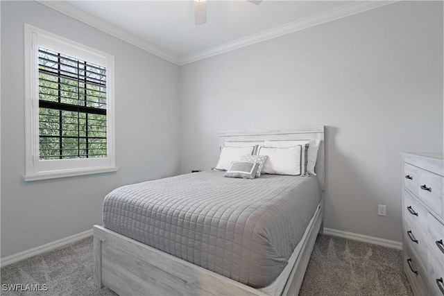 carpeted bedroom with baseboards, ceiling fan, and crown molding