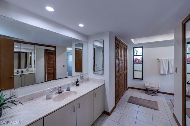 full bathroom featuring tile patterned floors, baseboards, recessed lighting, and vanity