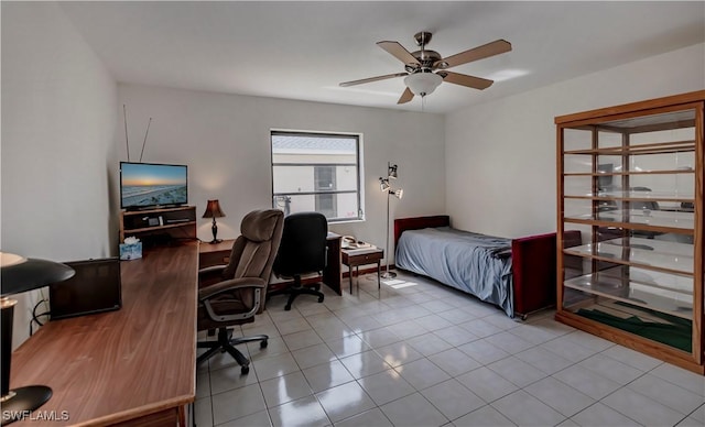 tiled bedroom with ceiling fan