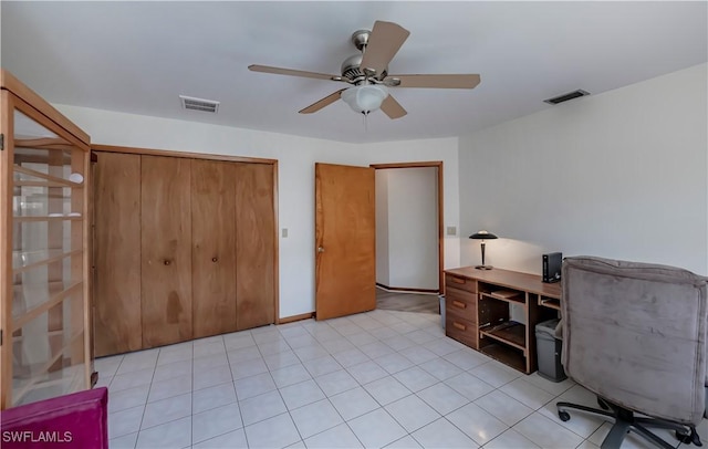 office space featuring light tile patterned floors, visible vents, and a ceiling fan