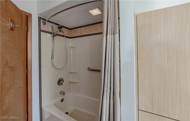 bathroom with shower / tub combo with curtain