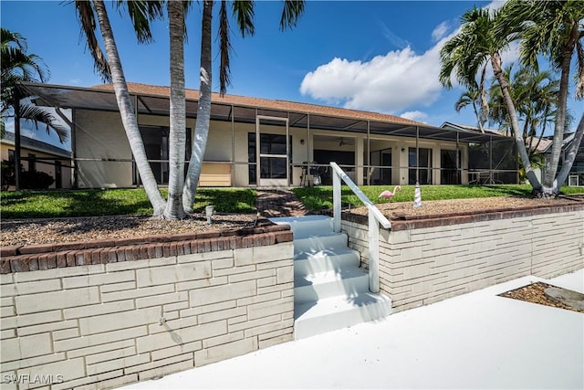 view of front of house with a lanai