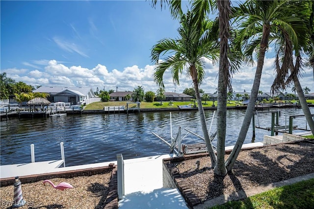 dock area featuring a residential view and a water view