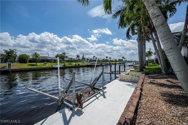 dock area featuring a water view and boat lift