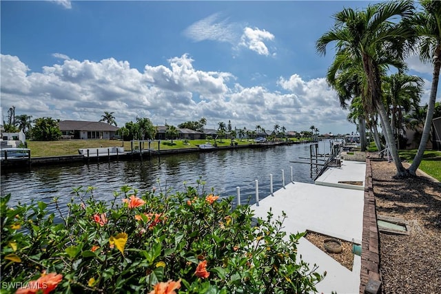 view of water feature with a residential view and a dock