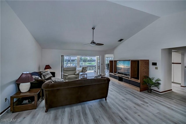 living room with visible vents, baseboards, ceiling fan, and wood finished floors